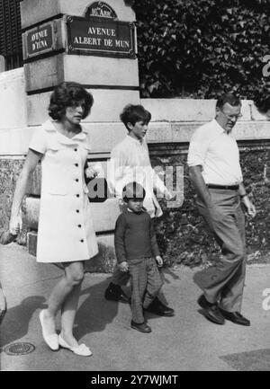 Walking in Paris today with his aunt Mrs Eunice Sargent Shriver and cousin Marc Shriver , aged four , is Robert Kennedy Jr , son of the late Senator Kennedy .  On the right is M. Lem Billings , a friend of the Shriver family , 26th June 1968 Stock Photo