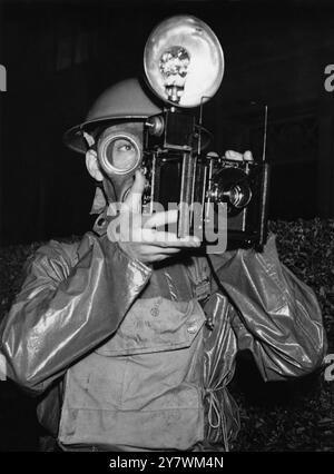 Press photographer in gas mask - 1939  ©TopFoto Stock Photo