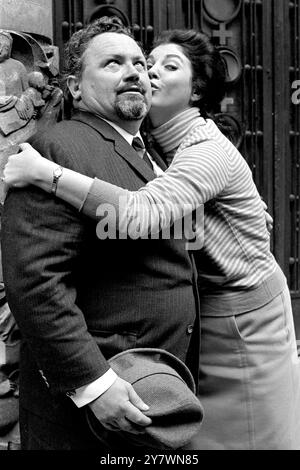 Comedian Harry Secombe receives some fond treatment from his mistress , leading opera singer Joyce Blackham , who has been cast for the important role of Milady ( a mistress of the art of amorous pursuit ) in the musical The Four Musketeers in which Harry appears as D'artagnan , the ultra skillful swordsman at the theatre in Drury Lane , London. 4 October 1967 Stock Photo