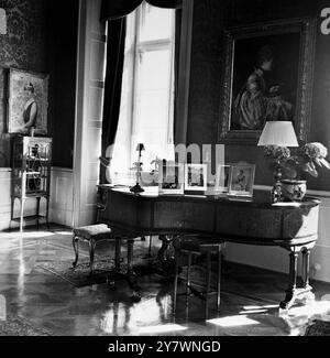 Home of the Danish Royalty - Placed upon the Steinway Piano , which has delicate intarsia work on the sides , are signed portraits of the Danish King and Queen and of Queen Elizabeth II and the Duke of Edinburgh - 1st July 1959 ©TopFoto Stock Photo