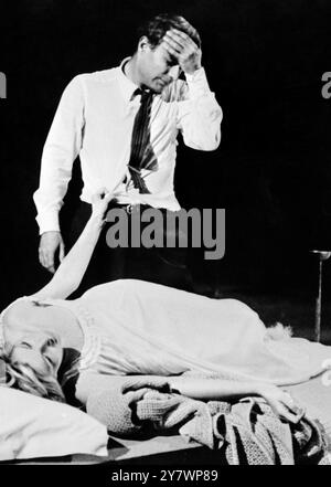 Italian actress and actor , Monica Vitti and Goirgio Albertazzi are shown in a scene from American dramatist Arthur Miller's new play , After the Fall . The play is believed by many to be based on the life of the late Marilyn Monroe , who was once married to Miller . 29 December 1964 Stock Photo