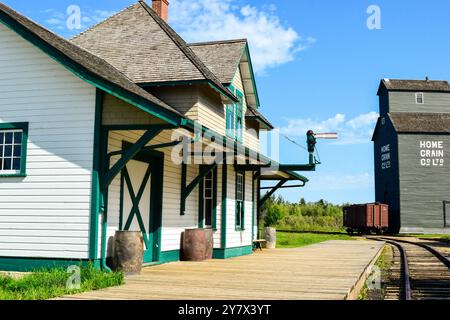 Wooden Cabins surrounded by nature at Ukrainian Heritage Village in Canada, on a sunny day Stock Photo