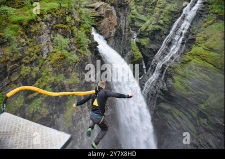 bungee jumping into a waterfall from the Gorsa Bridge in northern Norway. Stock Photo