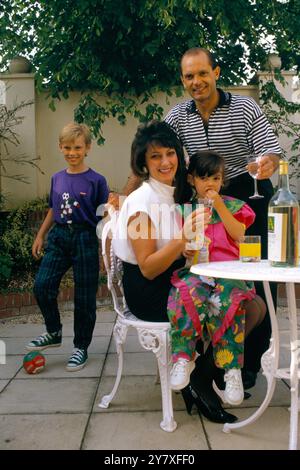 Raymond Wilkins, MBE (14 September 1956 – 4 April 2018) was an English football player and coach with family (wife Jackie)  at home in Putney. London, England circa1995 1990s UK HOMER SYKES Stock Photo