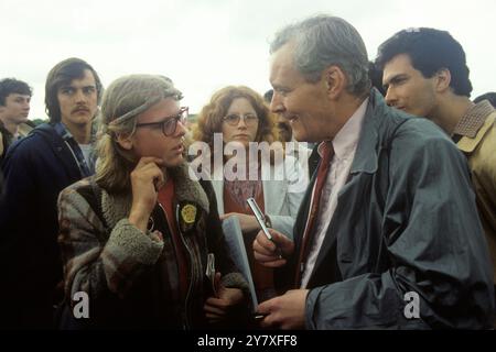 Tony Benn MP, the Labour Parties CND Hyde Park demonstration 'Nuclear Arms No, Peace Yes' march and rally. The young man, Labour Party supporter talking to Benn, wears a yellow badge that reads ‘Who’s Next For A Tory Cuts’ 1982 1980s UK HOMER SYKES Stock Photo