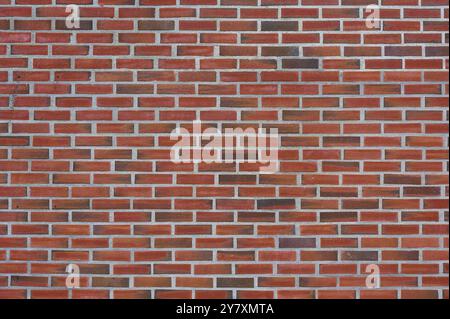 An evenly laid brick wall made of red bricks. The joints are clean and regular, Bergen, Vestland, Norway, Europe Stock Photo