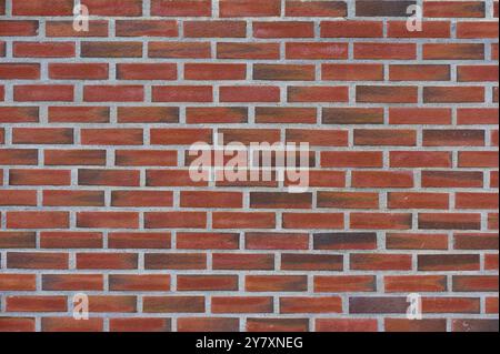 An evenly laid brick wall made of red bricks. The joints are clean and regular, Bergen, Vestland, Norway, Europe Stock Photo