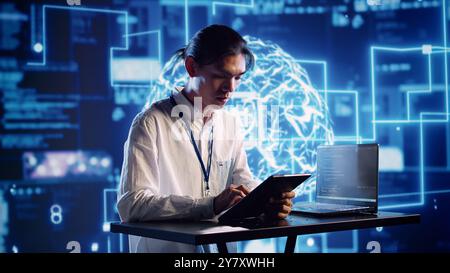 Productive engineer in high tech workspace uses artificial intelligence computing simulating human brain. Admin in server farm running operations on laptop with AI machine learning algorithms Stock Photo