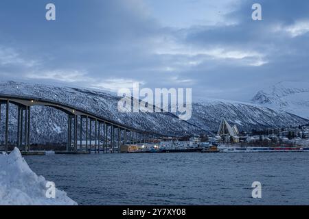 Tromsø Bridge and Arctic Cathedral in Tromsø in December. Stock Photo