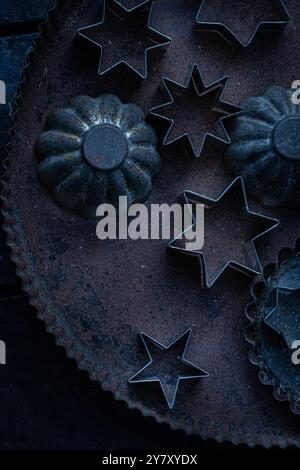 Old cookie molds on sheet Stock Photo