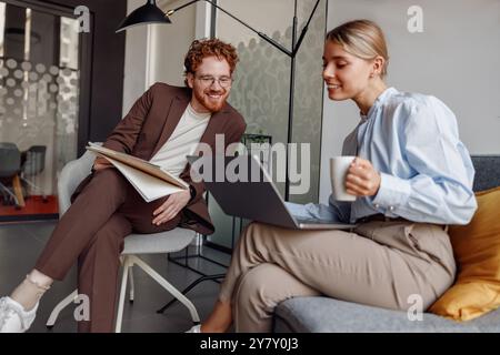 Engaging in Collaborative Work within a Modern Office Environment for Enhanced Productivity Stock Photo