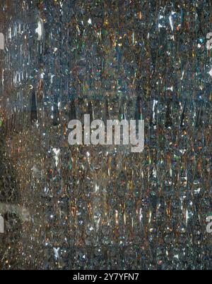 Abstract art of cut glass, reflecting light in a wide array of colors, shapes and patterns. Illuminated background Stock Photo