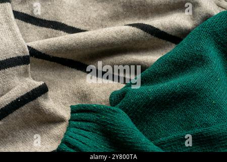 Two hand knitted wool sweaters. Background textures. Stock Photo