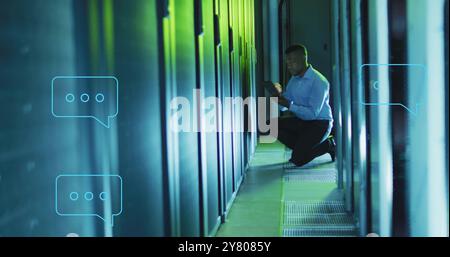 Image of ai chat dialogue over african american technician using tablet in server room Stock Photo
