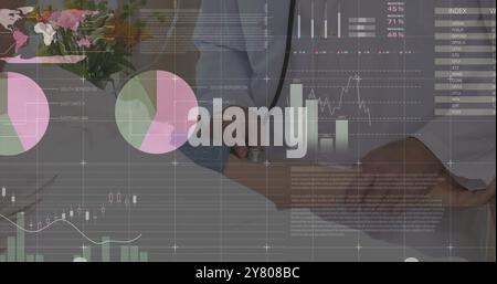 Image of statistics and data processing over caucasian male doctor Stock Photo