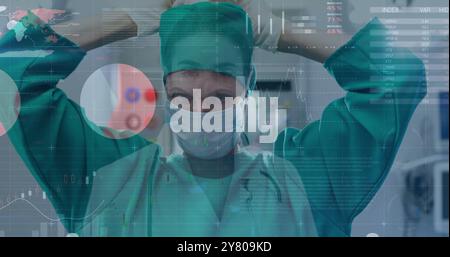 Image of statistics and data processing over caucasian female surgeon Stock Photo