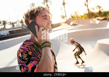 stylish millennial guy using mobile phone Stock Photo