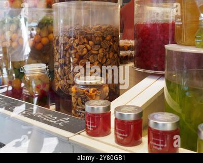 Mantua, Italy September 30th 2024 Glass jars and containers displaying colorful preserves, creating an appealing scene for tourists visiting mantua's Stock Photo