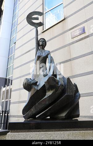 Statue of the goddess Europa with Euro currency symbol in front of the ...