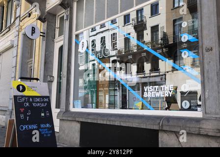 Fashionable Rue Antione Dansaert with high end boutique shops, restaurants & cafes, in Brussels, Belgium. Stock Photo