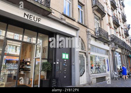Fashionable Rue Antione Dansaert with high end boutique shops, restaurants & cafes, in Brussels, Belgium. Stock Photo