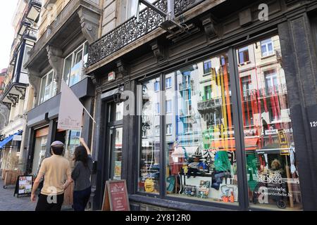 Fashionable Rue Antione Dansaert with high end boutique shops, restaurants & cafes, in Brussels, Belgium. Stock Photo