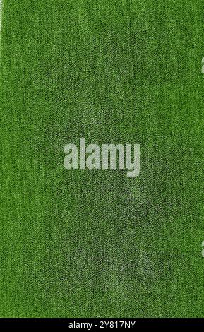 The textile background is green with a rough surface and light spots Stock Photo