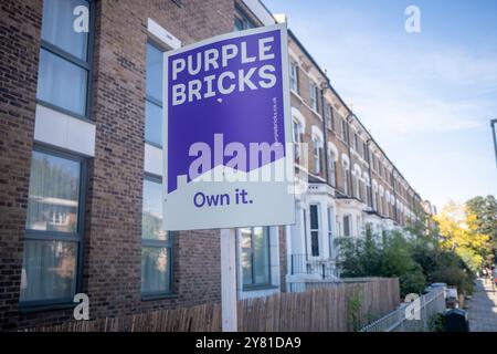 LONDON- SEPTMEBER 13, 2024: Purple Bricks estate agency 'for sale' sign board. A British internet based estate agent Stock Photo