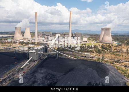 Aerial view of piles of coal and the Bayswater coal-fired power station near Muswellbrook in the Hunter Valley, NSW, Australia Stock Photo