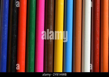 Colored pencils, colored wooden sticks, colored straws, background concept Stock Photo