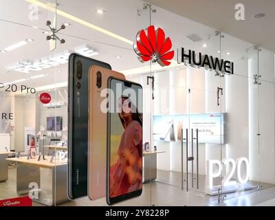 Sign and logo of Huawei above the store entrance. Stock Photo