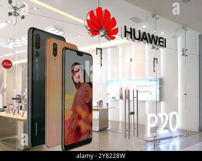 Sign and logo of Huawei above the store entrance. Stock Photo