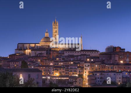 Blue hour over Siena skyline. On the top the cathedral also known as Duomo di Siena. Tuscany region, Italy Stock Photo