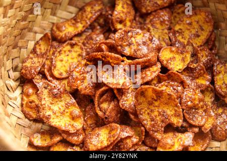 Organic crispy corn flakes with chocolate in rustic wicker bowl. Macro shot Stock Photo