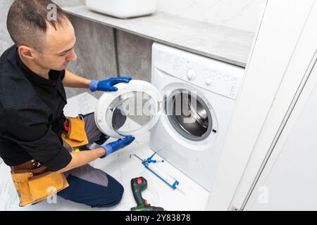 studio photo of washing machine repairman Stock Photo