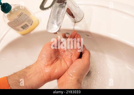 Global Handwashing Day Concept. Washing hands with soap under the water ...