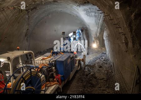Prague Metro D Building Process. Machine application of plaster on the wall. The machine sprays plaster on the wall. Stock Photo