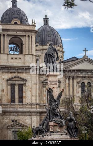 Back view of a local cholita seated in the Plaza Murillo, La Paz, Bolivia Stock Photo