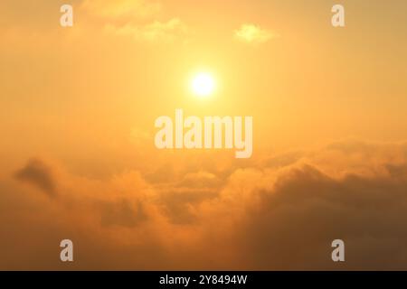 A magical sunset high over the clouds. Stock Photo