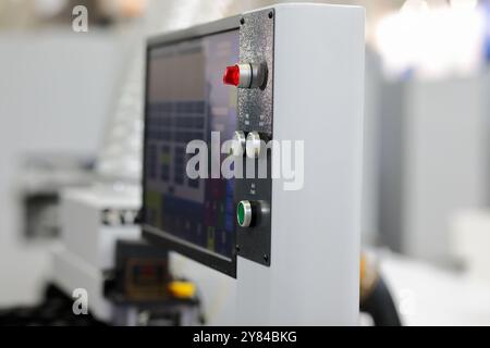 Modern industrial touch screen control console. Selective focus. Stock Photo