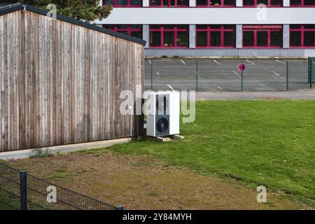 Two stacked heat pumps on a lawn in front of a house, Germany, Europe Stock Photo