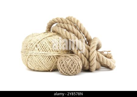 Close-up image of various natural fiber ropes and twine on a white background, showcasing textures and materials used in crafts and industry Stock Photo
