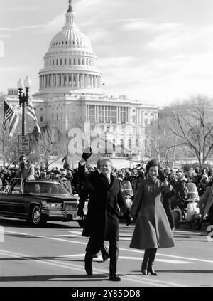 President Jimmy Carter and First Lady Rosalynn Carter walk down Pennsylvania Avenue to the White House after the swearing-in ceremony at the Capitol on January 20, 1977. (USA) Stock Photo