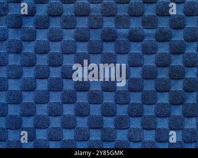 Blue synthetic canvas fabric in checkerboard and checkered pattern. Seamless blue checkered background texture. Stock Photo