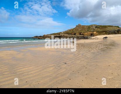 Beautiful sandy Porthmeor Beach with the Island headland and Chapel in the distance on a sunny September day, St. Ives, Cornwall, England, UK Stock Photo