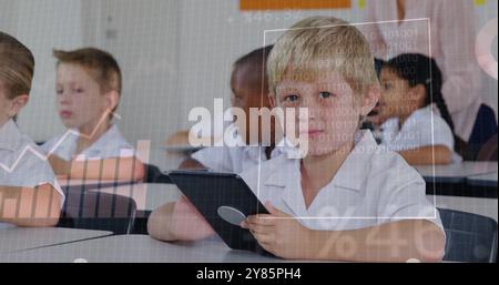 Children in classroom using tablets, data processing image over them Stock Photo