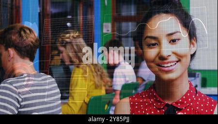 Binary code image over students studying in classroom Stock Photo