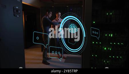 Image of ai scanner, brain and chat icons over diverse technicians in dark server room Stock Photo