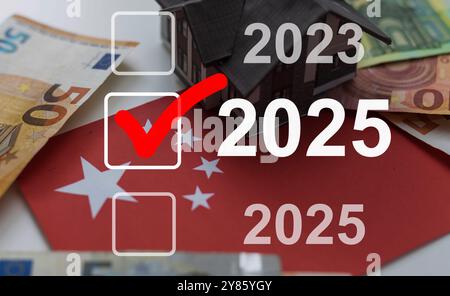 Businessman pointing to digital 2025 on virtual screen. Countdown to 2025 concept. Space for text. New Year's Eve and changing the year 2024 to 2025 Stock Photo