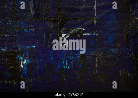 Macro close-up of an abstract black and dark blue acrylic paint background. High resolution full frame textured canvas background with copy space. Stock Photo